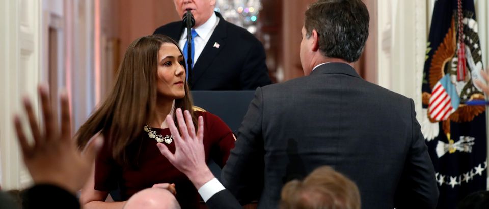 White House staff member tries to take microphone from CNN's Acosta as U.S. President Trump holds news conference at the White House in Washington