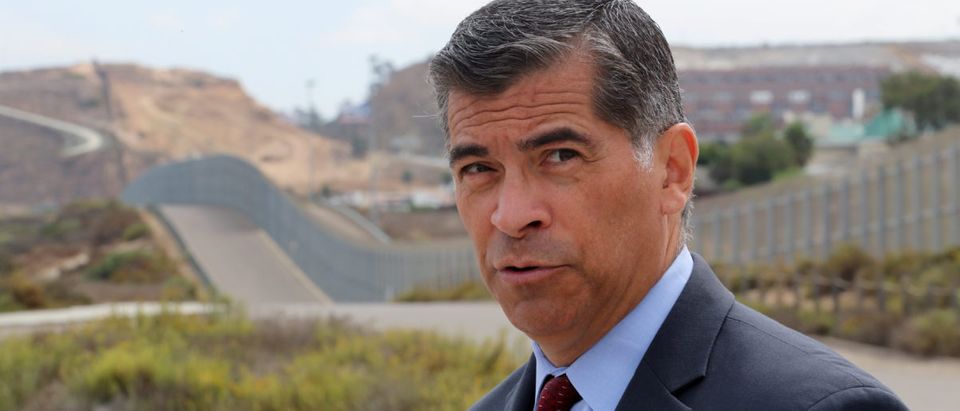 Attorney General of California Xavier Becerra walks along the U.S.-Mexico border at the Pacific Ocean after announcing a lawsuit against the Trump Administration over its plans to begin construction of border wall in San Diego and Imperial Counties, in San Diego, California, U.S., Sept. 20, 2017. REUTERS/Mike Blake