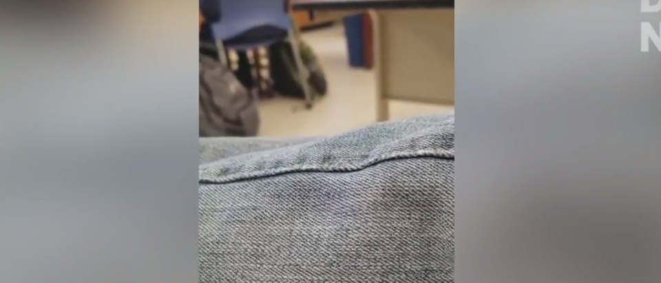 A high school student allegedly got called an "asshole" by his teacher for refusing to take off his "Make America Great Again" hat in class. (YouTube/TheDCNF)