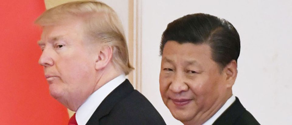 File photo taken in November 2017 shows U.S. President Donald Trump (L) and Chinese President Xi Jinping at their joint press conference at the Great Hall of the People in Beijing. (Photo by Kyodo News via Getty Images)