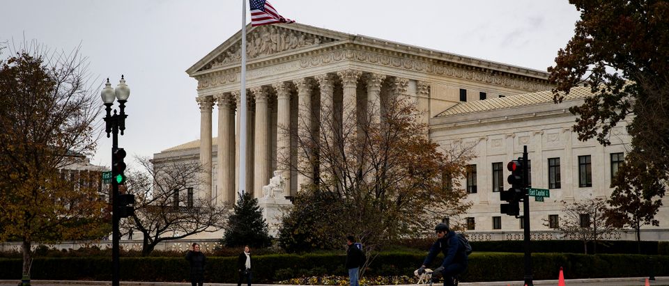 A man rides a bicycle past the Supreme Court in Washington, U.S., November 13, 2018. REUTERS/Al Drago