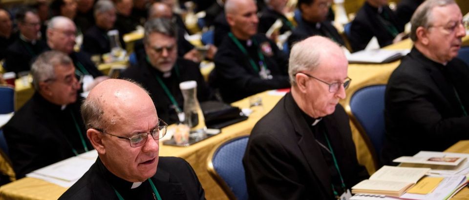 Members of the Catholic church say a prayer during an opening session of the annual US Conference of Catholic Bishops November 12, 2018 in Baltimore, Maryland. (BRENDAN SMIALOWSKI/AFP/Getty Images)