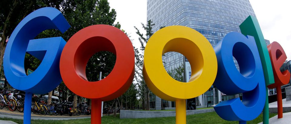 FILE PHOTO: The brand logo of Alphabet Inc's Google is seen outside its office in Beijing, China August 8, 2018. Picture taken with a fisheye lens. REUTERS/Thomas Peter