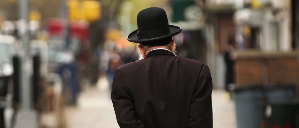 NEW YORK, NY - APRIL 24: A Hasidic man walks through a Jewish Orthodox neighborhood in Brooklyn on April 24, 2017 in New York City. According to a new report released by the Anti-Defamation League (ADL), anti-Semitic incidents in the U.S. rose by 86 percent in the first three months of the year. The group's audit of anti-Semitic events counted 541 anti-Semitic attacks and threats in the first quarter of the year, a significant increase over the same period last year. (Photo by Spencer Platt/Getty Images)