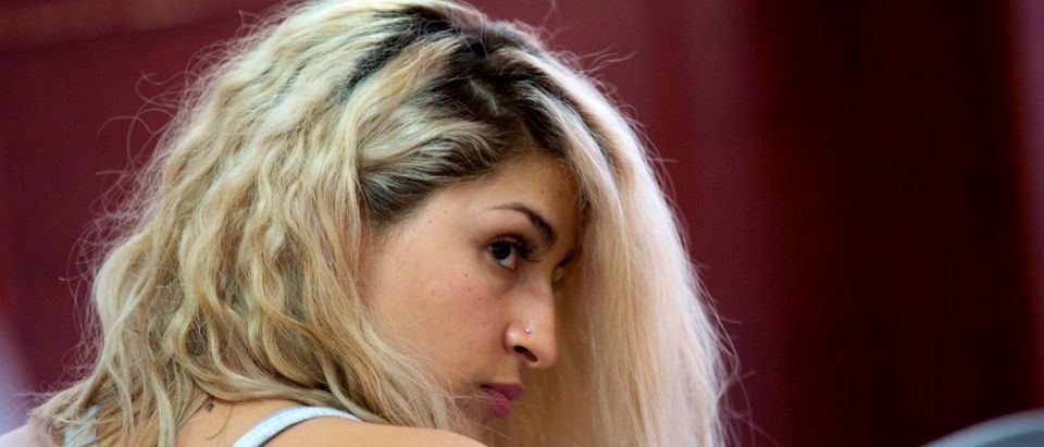Colombian Yulieth Lozano, alleged member of a prostitution network, is pictured before a hearing at a court in Medellin, Colombia, on Dec. 10, 2018. (JOAQUIN SARMIENTO/AFP/Getty Images)