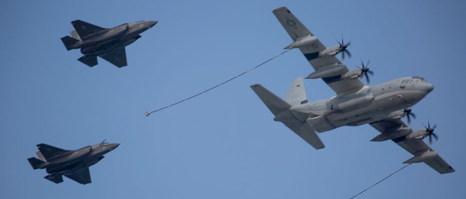 A KC-130J Super Hercules with Marine Aerial Refueler Transport Squadron (VMGR) 152 demonstrates an aerial refuel with an F/A-18D Hornet with Marine All Weather Fighter Attack Squadron (VMFA) 242 and F-35B Lightning II aircraft with Marine Fighter Attack Squadron (VMFA) 121 during the 42nd Japan Maritime Self-Defense Force – Marine Corps Air Station Iwakuni Friendship Day at MCAS Iwakuni, Japan, May 5, 2018. Since 1973, MCAS Iwakuni has held a single-day air show designed to foster positive relationships and offer an exciting experience that displays the communal support between the U.S. and Japan. The air show also encompassed various U.S. and Japanese static display aircraft, aerial performances, food and entertainment. (U.S. Marine Corps photo by Cpl. Deseree Kamm)