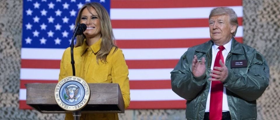 US President Donald Trump and First Lady Melania Trump speak to members of the US military during an unannounced trip to Al Asad Air Base in Iraq on December 26, 2018. - President Donald Trump arrived in Iraq on his first visit to US troops deployed in a war zone since his election two years ago (Photo by SAUL LOEB / AFP)