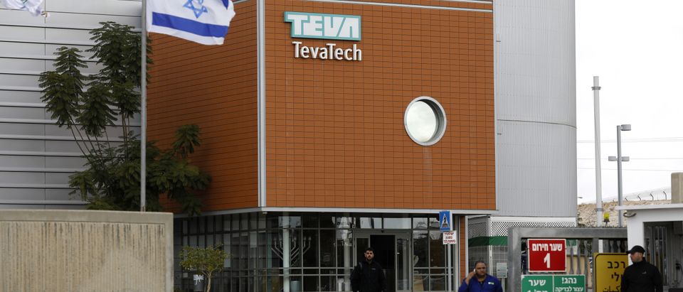 Israeli employees of Teva, the world's biggest manufacturer of generic drugs, gather outside the pharmaceutical company's plant in Ne'ot Hovav, an industrial south of Beersheva, on December 14, 2017. (MENAHEM KAHANA/AFP/Getty Images)