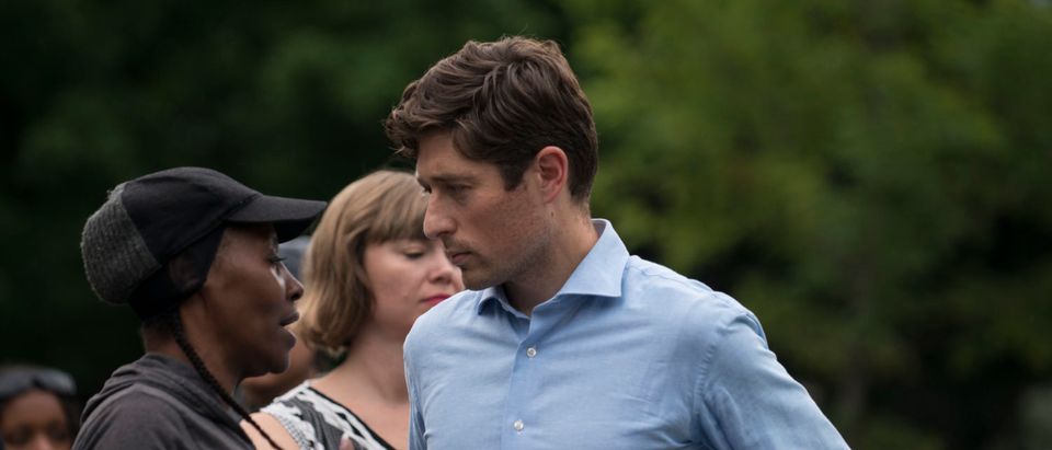 MINNEAPOLIS, MN - JUNE 24: Minneapolis Mayor Jacob Frey speaks with a woman at a vigil for Thurman Blevins on June 24, 2018 in Minneapolis, Minnesota. Blevins, 31, was shot and killed yesterday after an altercation with Minneapolis Police. (Photo by Stephen Maturen/Getty Images)