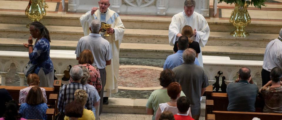 PITTSBURGH, PA - AUGUST 15: Parishioners worship during a mass to celebrate the Assumption of the Blessed Virgin Mary at St Paul Cathedral, the mother church of the Pittsburgh Diocese on August 15, 2018 in Pittsburgh, Pennsylvania. The Pittsburgh Diocese was rocked by revelations of abuse by priests the day before on August 14, 2018.(Photo by Jeff Swensen/Getty Images)
