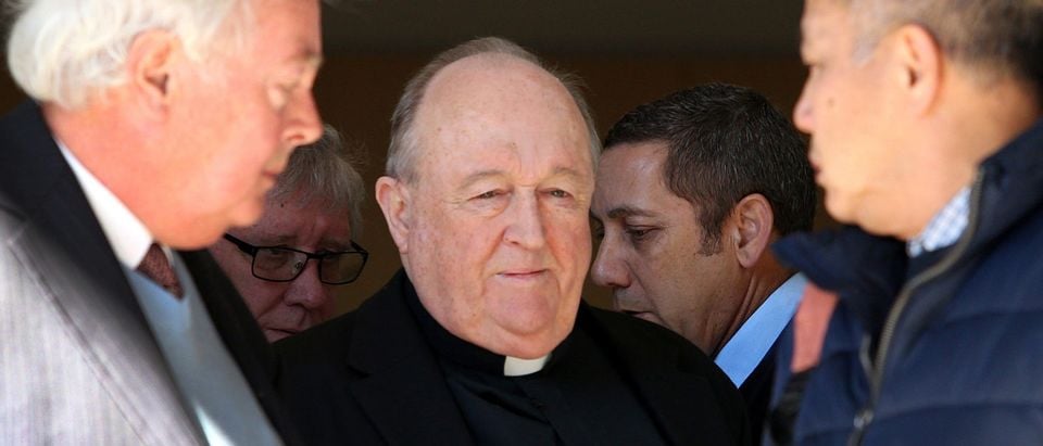 Former Australian archbishop Philip Wilson (C) leaves a court in Newcastle on August 14, 2018. - Wilson, a former Australian archbishop convicted of concealing abuse by a notorious paedophile priest in the 1970s, was spared jail on August 14, with a court ruling he can serve his sentence in home detention. (PETER LORIMER/AFP/Getty Images)