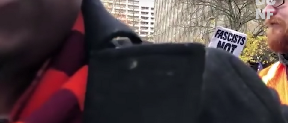 An Antifa protester in Seattle told journalist Andy Ngo that "death is coming to you," with the crowd of protesters continuing to call him a "Nazi Fascist." (YouTube/TheDCNF)