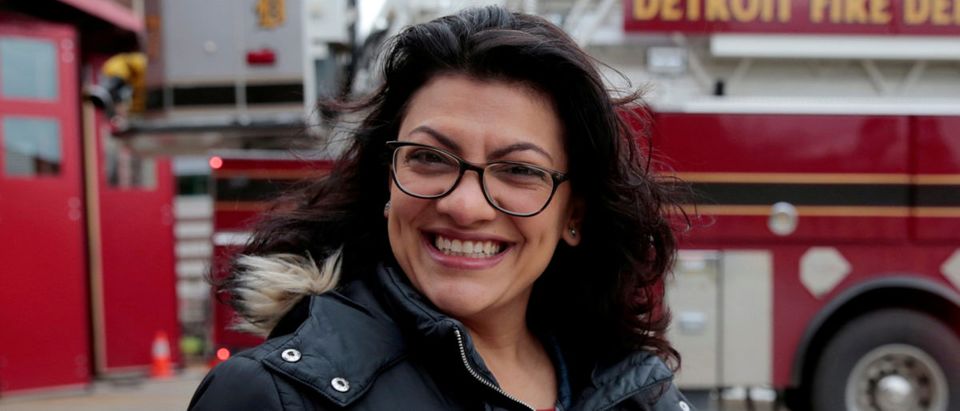 Democratic U.S. congressional candidate Rashida Tlaib points to her 'I voted' sticker after voting during the midterm election in Detroit