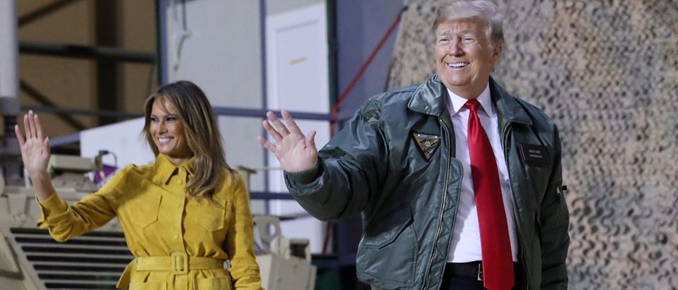 U.S. President Donald Trump, with first lady Melania Trump, arrives to deliver remarks to U.S. troops in an unannounced visit to Al Asad Air Base, Iraq, December 26, 2018. REUTERS/Jonathan Ernst -