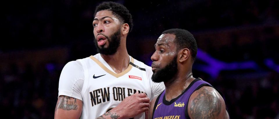 LOS ANGELES, CALIFORNIA - DECEMBER 21: LeBron James #23 of the Los Angeles Lakers guards Anthony Davis #23 of the New Orleans Pelicans during a 112-104 Laker win at Staples Center on December 21, 2018 in Los Angeles, California. (Photo by Harry How/Getty Images)