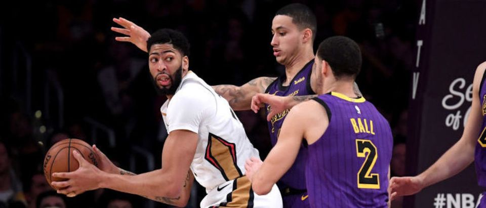 LOS ANGELES, CALIFORNIA - DECEMBER 21: Anthony Davis #23 of the New Orleans Pelicans is defended by Kyle Kuzma #0, Lonzo Ball #2 and Ivica Zubac #40 of the Los Angeles Lakers during a 112-104 Laker win at Staples Center on December 21, 2018 in Los Angeles, California. (Photo by Harry How/Getty Images)