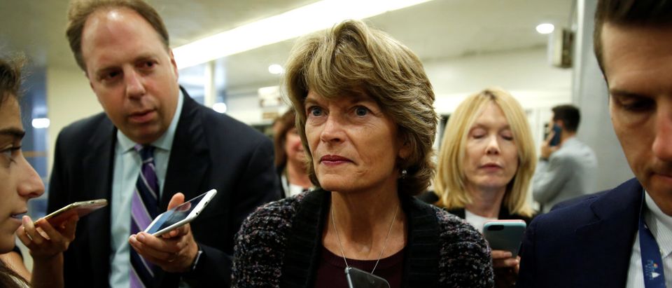 Sen. Lisa Murkowski speaks to journalists as she arrives for a vote on Capitol Hill in Washington, U.S., Sept. 24, 2018. REUTERS/Joshua Roberts