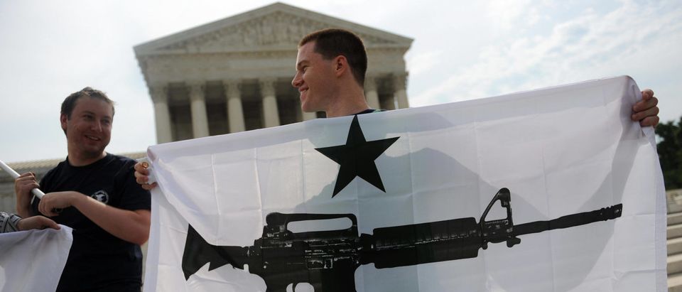 Gun rights activists celebrate the news from the Supreme Court that Americans have a constitutional right to bear arms on June 26, 2008 (Tim Sloan/AFP/Getty Images)