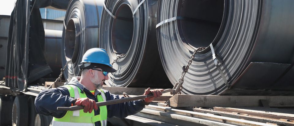 PORTAGE, IN - MARCH 15: Steel is loaded onto a truck for shipping at the NLMK Indiana steel mill on March 15, 2018 in Portage, Indiana. The coils, which are custom made to customer specifications, weigh an average of nearly 25 tons. The mill, which is projected to produce up to 1 million tons of steel from recycled scrap in 2018, is considered a mini mill by U.S standards. NLMK Indiana is a subsidiary of NLMK, one of Russia's largest steel manufacturers, responsible for nearly a quarter of Russias steel production. Steel producers in the U.S. and worldwide are preparing for the impact of the recently-proposed tariffs by the Trump administration of 25 percent on imported steel. (Photo by Scott Olson/Getty Images)