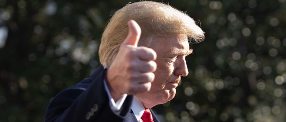 US President Donald Trump gives a thumbs-up as he speaks to the press as he walks to Marine One prior to departing from the South Lawn of the White House in Washington, DC, December 7, 2018. (Photo: SAUL LOEB/AFP/Getty Images)