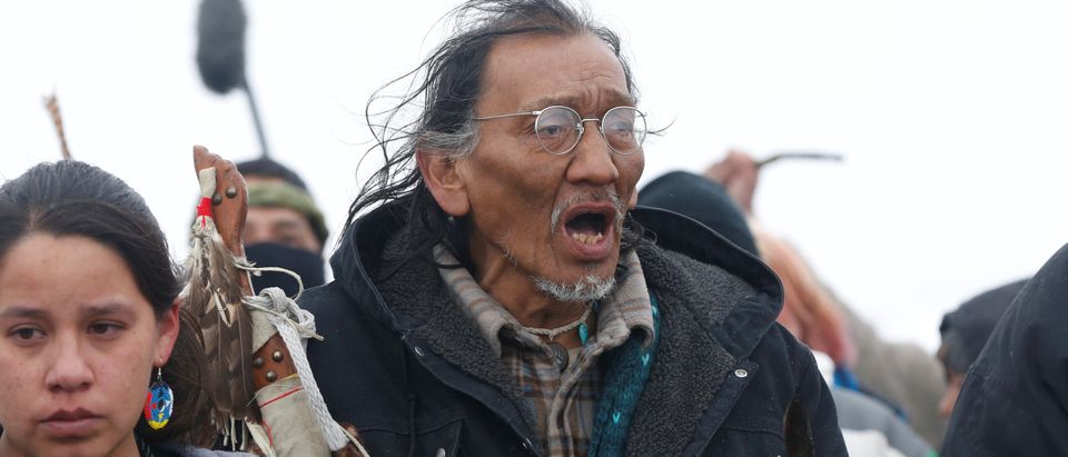 Nathan Phillips marches with other protesters out of the main opposition camp against the Dakota Access oil pipeline near Cannon Ball, North Dakota, U.S., February 22, 2017. Picture taken February 22, 2017. REUTERS/Terray Sylvester