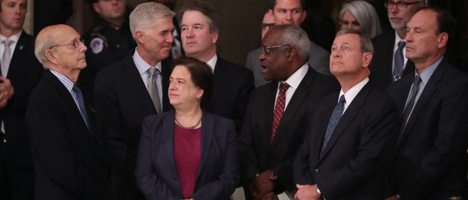 Justices of the U.S. Supreme Court including (L-R) Associate Justices Stephen Breyer, Neil Gorsuch, Elena Kagan, Brett Kavanaugh, Clarence Thomas, Chief Justice John Roberts and Associate Justice Samuel Alito await the arrival of the casket of former U.S. President George H.W. Bush inside the U.S. Capitol Rotunda, where it will lie in state in Washington, U.S., Dec. 3, 2018. REUTERS/Jonathan Ernst/Pool