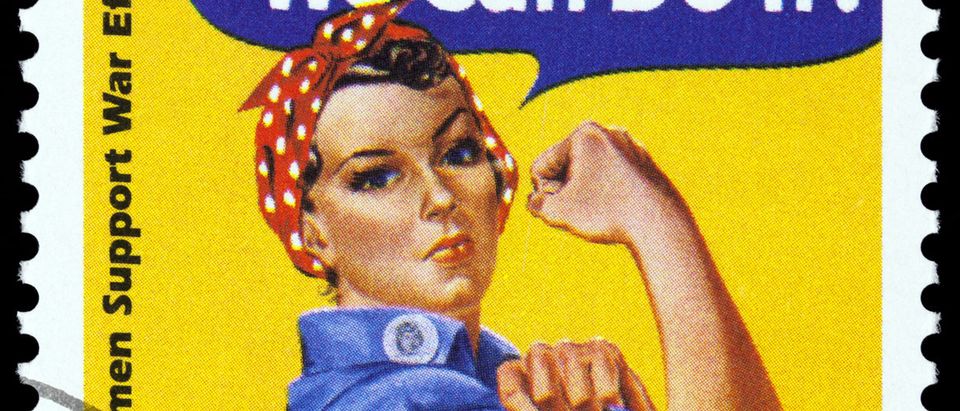 Canceled USA. postage stamp showing an image of Rosie The Riveter commemorating the American woman who worked in factories during the World War II, circa 1999. Shutterstock/TinaImages