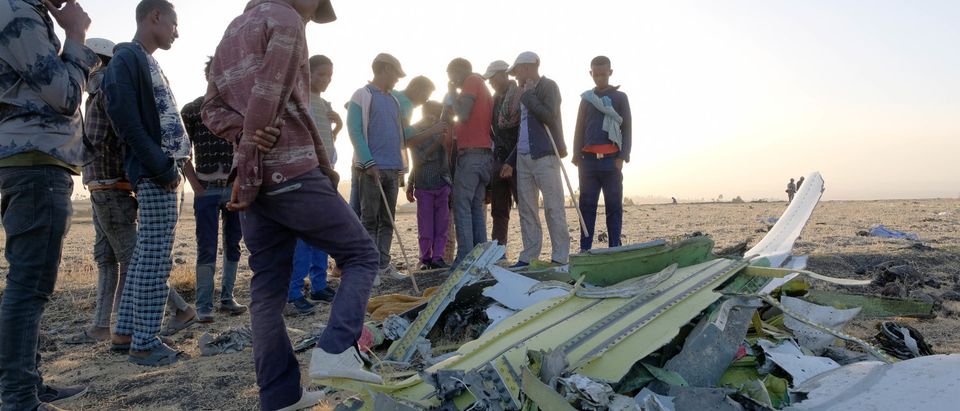 Workers Attend The Crash Site Of Ethiopian Airlines ET302 Flight To Nairobi