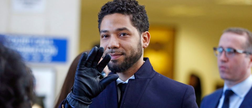 Actor Jussie Smollett waves as he follows his attorney to the microphones after his court appearance at Leighton Courthouse on March 26, 2019 in Chicago, Illinois. This morning in court it was announced that all charges were dropped against the actor. (Photo by Nuccio DiNuzzo/Getty Images)