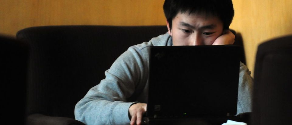 A man surfs the Internet at a cafe in Beijing on Dec. 6, 2009. FREDERIC J. BROWN/AFP/Getty Images