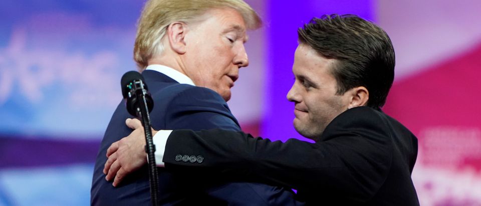 U.S. President Donald Trump hugs Hayden Williams, a member of the Leadership Institute, at the Conservative Political Action Conference (CPAC) annual meeting at National Harbor in Oxon Hill, Maryland, U.S., March 2, 2019. REUTERS/Joshua Roberts