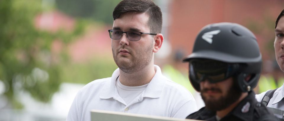 James Alex Fields Jr., (L) is seen attending the "Unite the Right" rally in Emancipation Park before being arrested by police and charged with charged with one count of second degree murder, three counts of malicious wounding and one count of failing to stop at an accident that resulted in a death after police say he drove a car into a crowd of counter-protesters later in the afternoon in Charlottesville, Virginia, U.S., August 12, 2017. REUTERS/Eze Amos