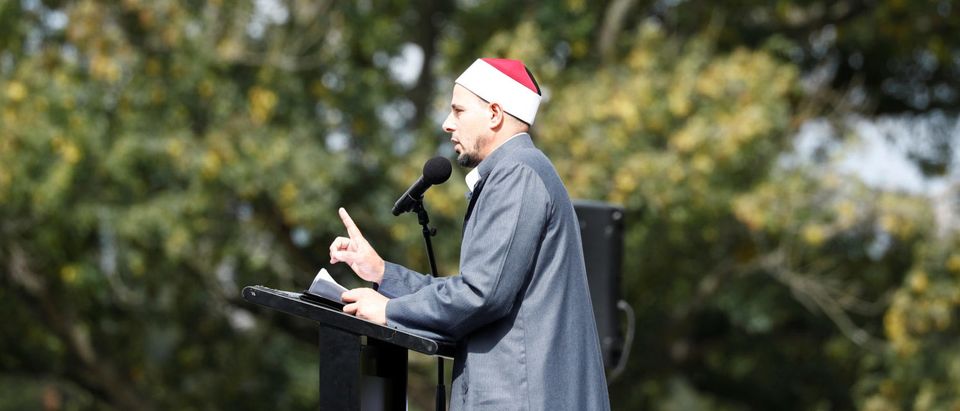 An imam leads a Friday prayer at Hagley Park outside Al-Noor mosque in Christchurch, New Zealand March 22, 2019. REUTERS/Edgar Su