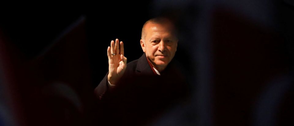 Turkish President Tayyip Erdogan greets AK Party supporters during a rally for the upcoming local elections in Istanbul