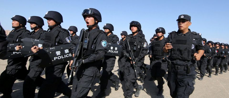 Chinese soldiers participate in an anti-terror drill in Hami, Xinjiang Uighur Autonomous Region
