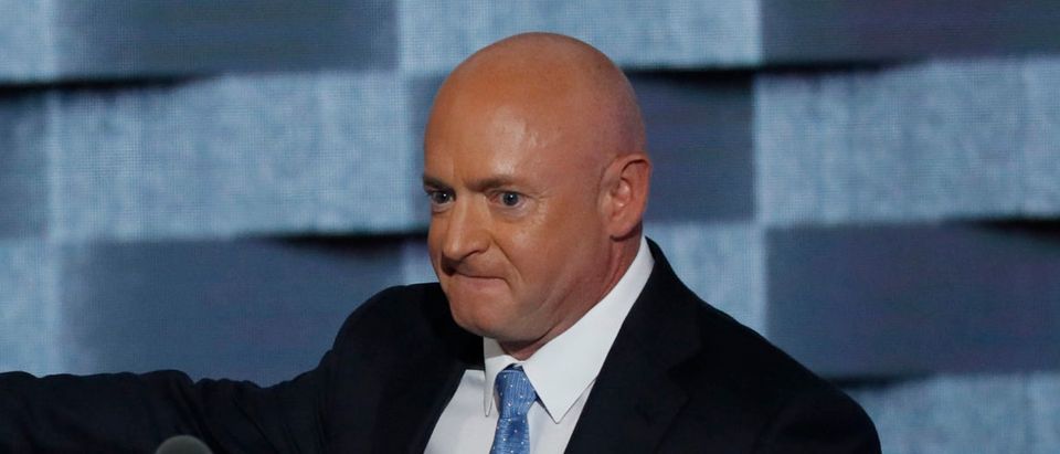Retired astronaut Mark Kelly (R) introduces his wife, former U.S. Representative Gabby Giffords, victim of a shooting attack while she was a member of Congress, to speak on the third night at the Democratic National Convention in Philadelphia, Pennsylvania, U.S. July 27, 2016. REUTERS/Mike Segar