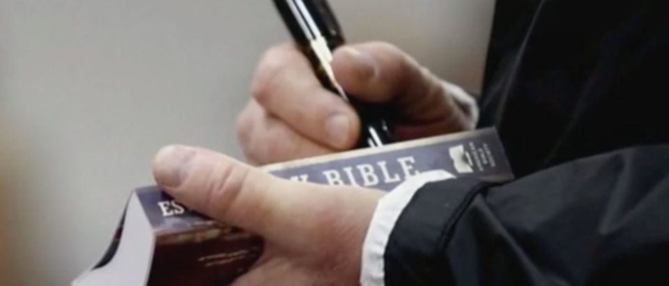 President Donald Trump signs Bibles during visit to Alabama 3/8/2019. Screen Shot/MSNBC