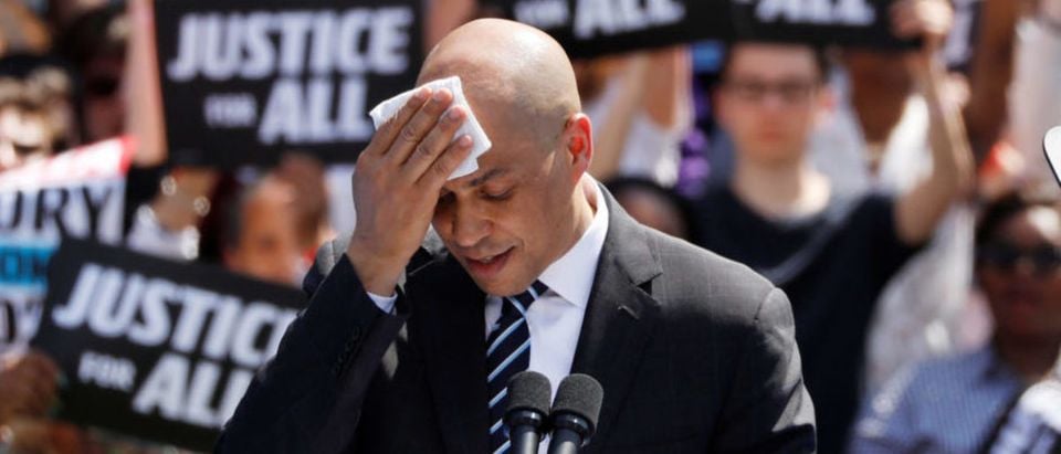 U.S. Sen. Cory Booker wipes perspiration as he speaks at his Hometown Kickoff event, part of the senator's "Justice for All" tour, the first such national tour of his presidential campaign in Newark, New Jersey, U.S., April 13, 2019. REUTERS/Andrew Kelly