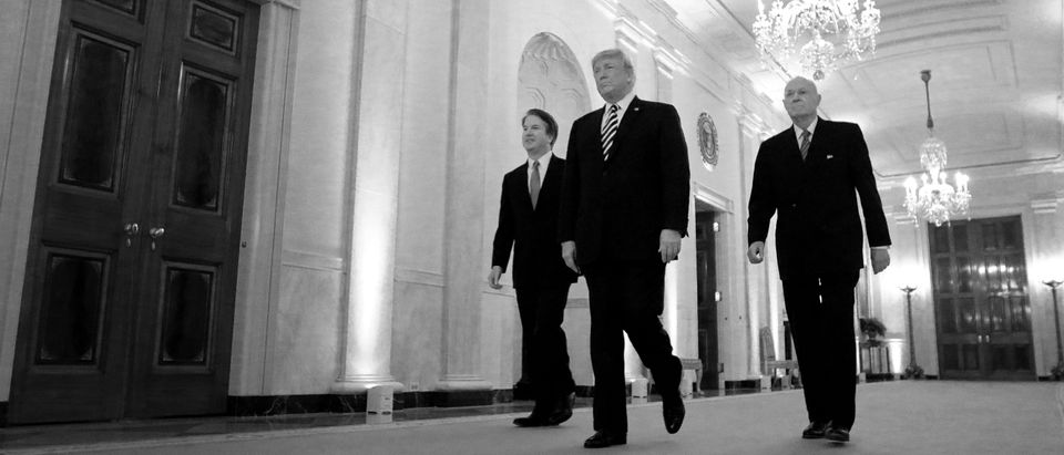 (L-R) Supreme Court Justice Brett Kavanaugh, President Donald Trump and retired Justice Anthony Kennedy walk into the East Room of the White House for Kavanaugh's ceremonial swearing on October 08, 2018. (Chip Somodevilla/Getty Images)