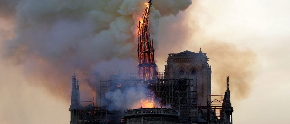The steeple of the landmark Notre-Dame Cathedral collapses as the cathedral is engulfed in flames in central Paris on April 15, 2019.(Geoffroy Van Der Hasselt/AFP/Getty Images)