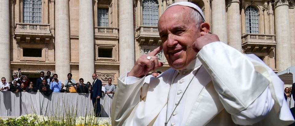 TOPSHOT - Pope Francis plugs his ears during his weekly general audience at St. Peter's Square in The Vatican on April 24, 2019. (VINCENZO PINTO/AFP/Getty Images)