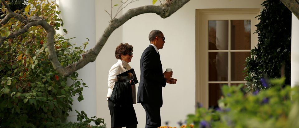 U.S. President Barack Obama walks with senior advisor Valerie Jarrett as he returns to the White House in Washington after attending a Veterans Day ceremony at Arlington National Cemetery November 11, 2016. REUTERS/Kevin Lamarque