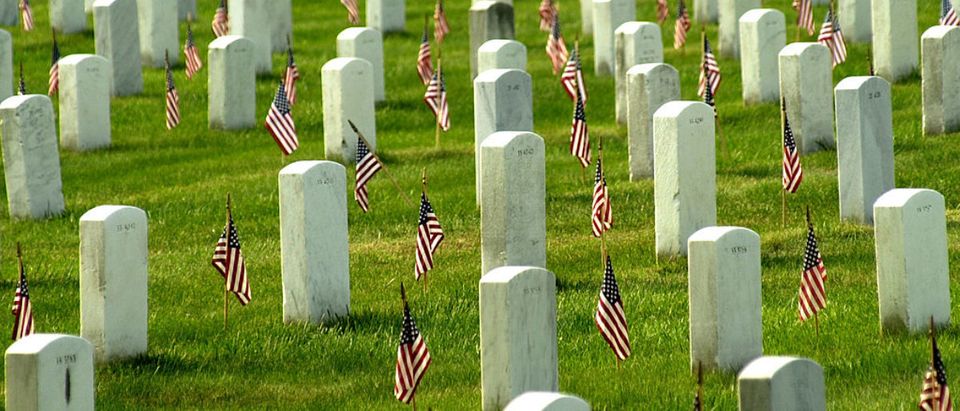 American flags adorn each grave in Arlington National Cemetary in honor of Memorial Day May 27, 2002 in Arlington, VA. Thousands of tourists, veterans, armed services personnel, and relatives visited the cemetery in recognition of Memorial Day. (Photo by Stefan Zaklin/ Getty Images)