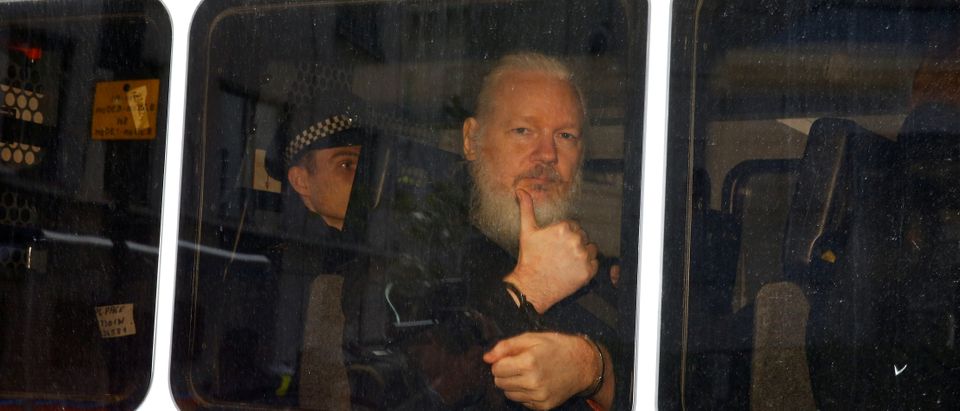 WikiLeaks founder Julian Assange is seen in a police van after was arrested by British police outside the Ecuadorian embassy in London, Britain April 11, 2019. REUTERS/Henry Nicholls