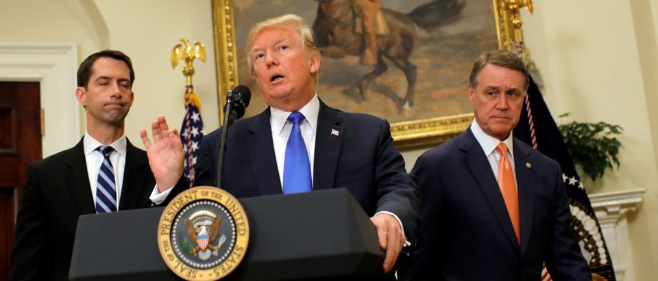 U.S. President Donald Trump speaks during an announcement on immigration reform accompanied by Senator Tom Cotton and Senator David Perdue, in the Roosevelt Room of the White House in Washington, U.S.