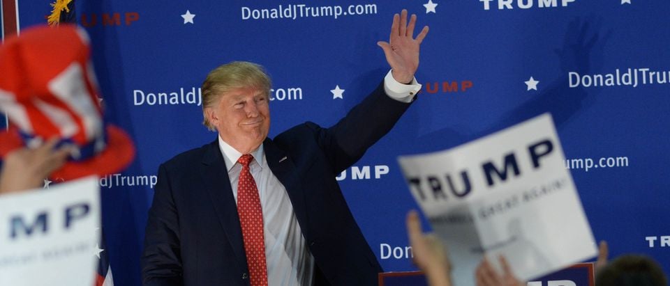Republican Presidential candidate Donald Trump waves to the crowd after speaking at a rally at Pennichuck Middle School December 28, 2015 in Nashua, New Hampshire. (Photo by Darren McCollester/Getty Images)