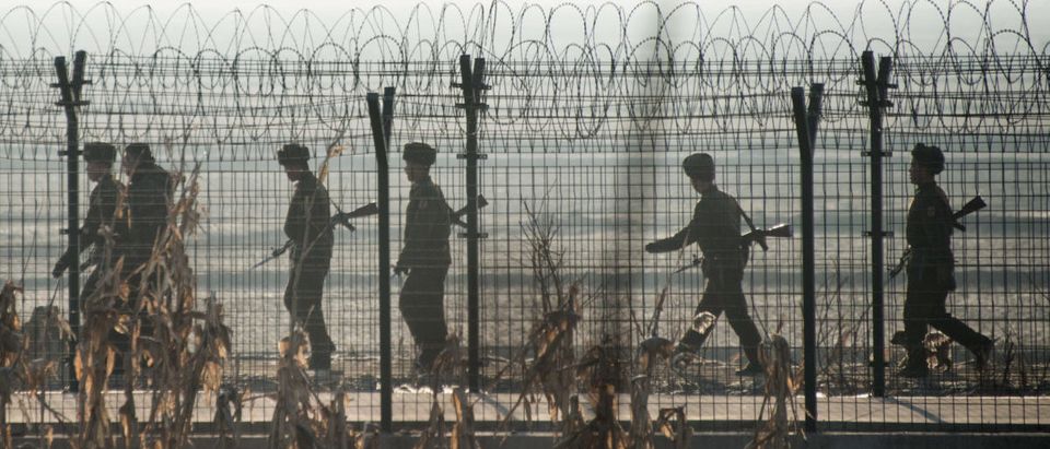 North Korean soldiers patrol next to the border fence near the town of Sinuiju across from the Chinese border town of Dandong on February 10, 2016. (JOHANNES EISELE/AFP/Getty Images)