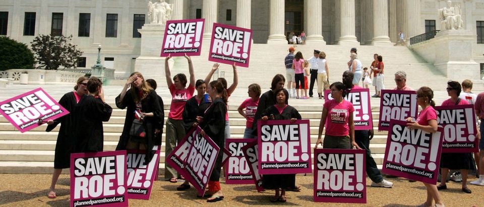 Members of Planned Parenthood protests in front of the Supreme Court on the day that Sandra Day O'Connor, the first woman on the Supreme Court and a swing vote on abortion, announced her retirement July 1, 2005 in Washington, DC. (Joe Raedle/Getty Images)