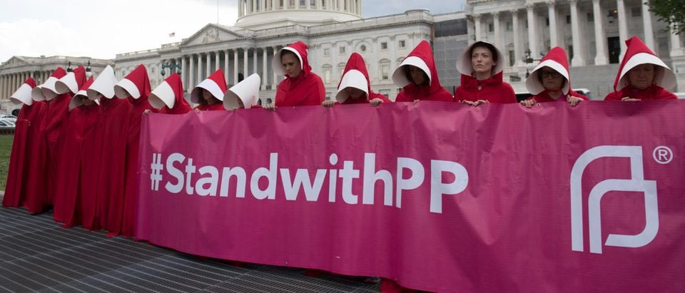 Supporters of Planned Parenthood hold a rally as they protest the Senate GOP healthcare bill outside the Capitol on June 27, 2017. (Saul Loeb/AFP/Getty Images)
