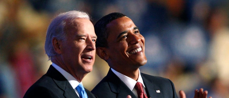 Barack Obama and Joe Biden applaud on stage at the 2008 Democratic National Convention in Denver